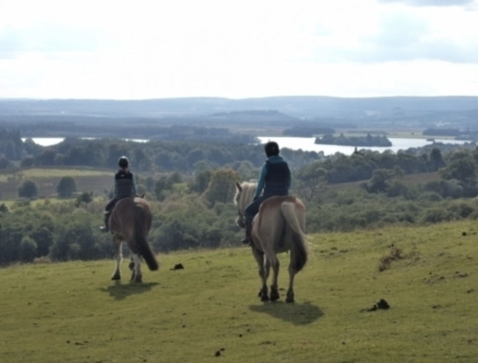 Trekker at Castle Rednock with Lake of Menteith